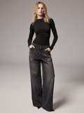 Blonde curly-haired model wearing Charcoal Black Wide-Leg Jeans