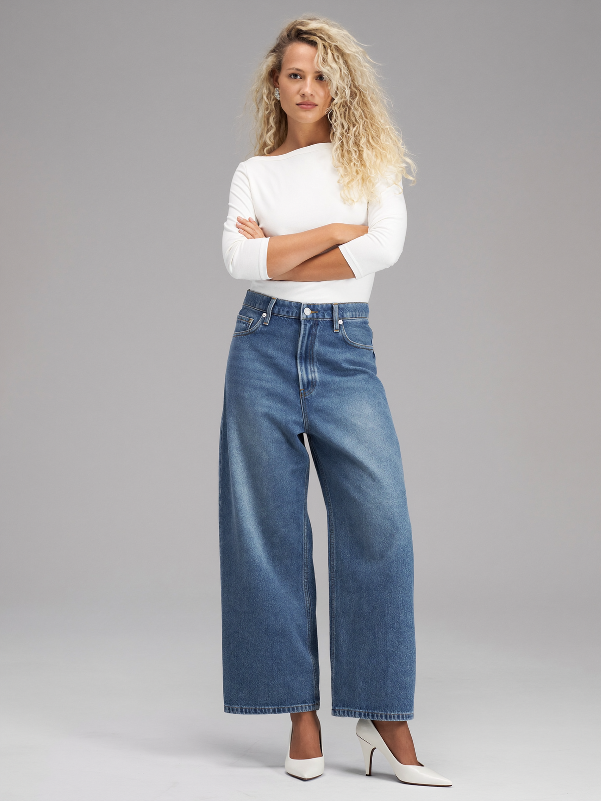 Blonde curly-haired model wearing Classic Straight-Leg Jeans