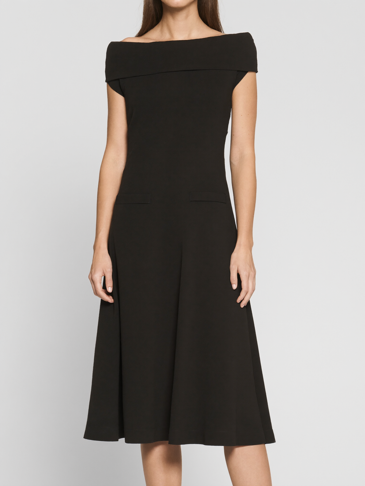 Model wearing black boatneck ponte midi dress with pockets