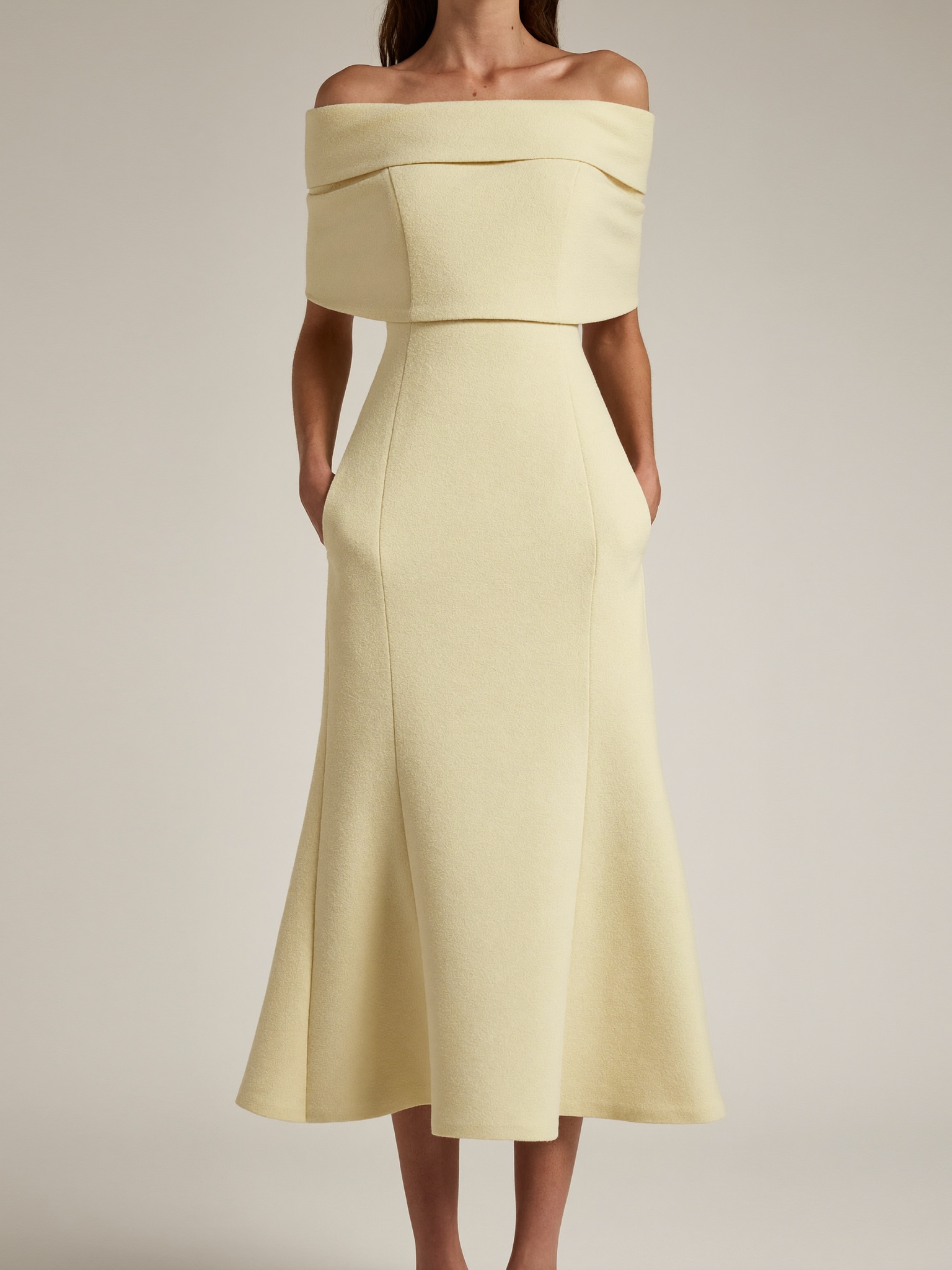 Model wearing milk cream boatneck ponte midi dress with pockets