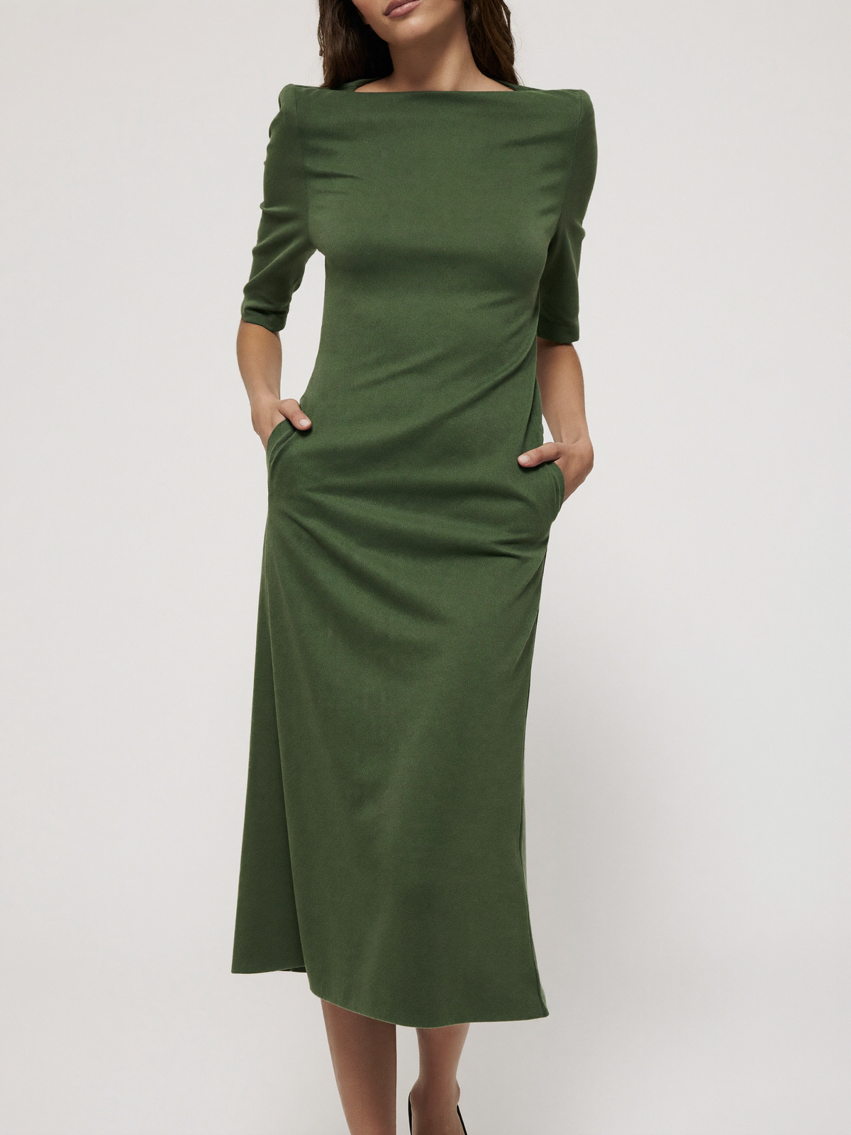 Model wearing artichoke green boatneck ponte midi dress with pockets