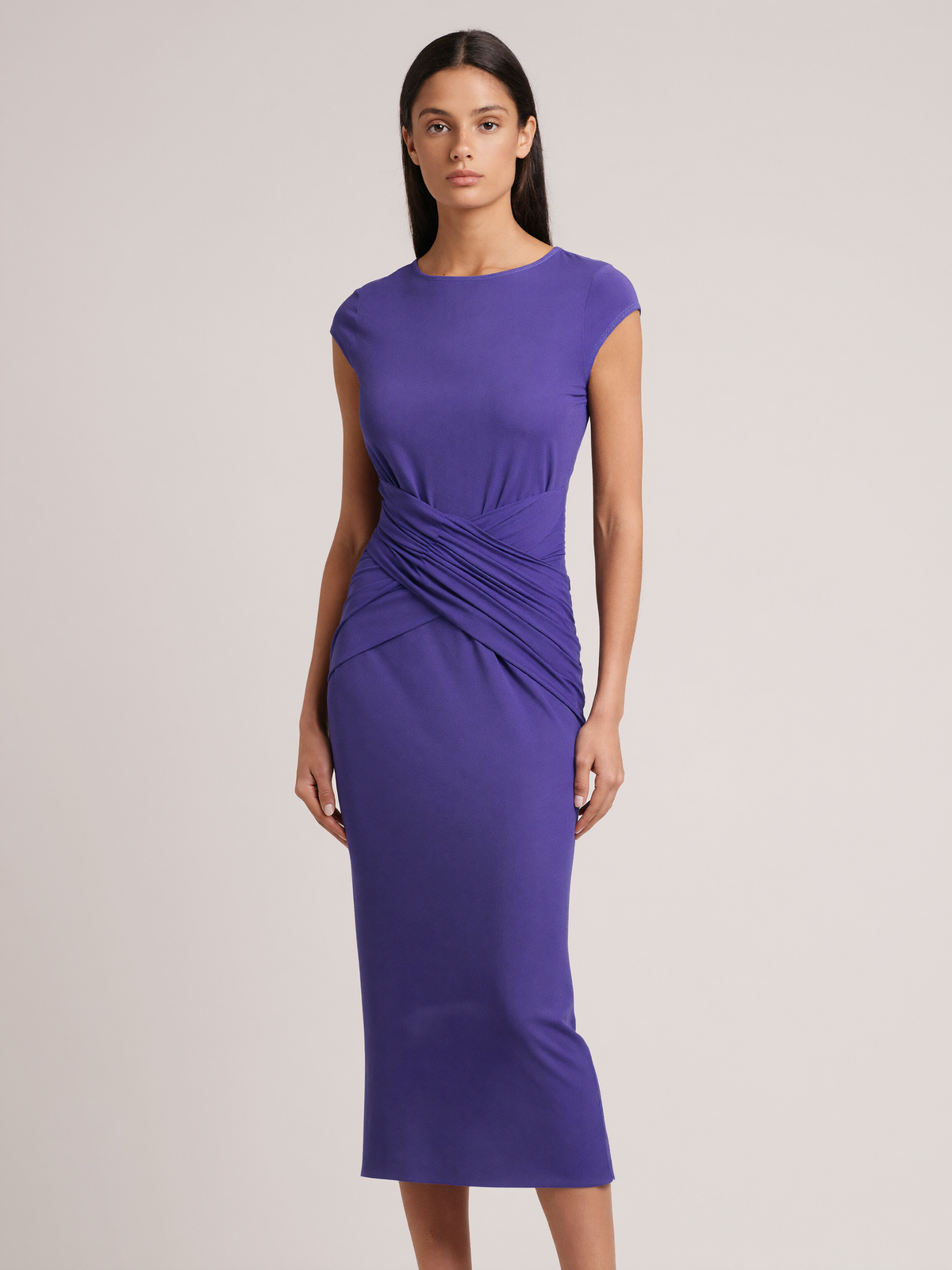 Model wearing purple-blue bodycon twist-waist cocktail dress