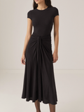 Model wearing black bodycon twist-waist cocktail dress